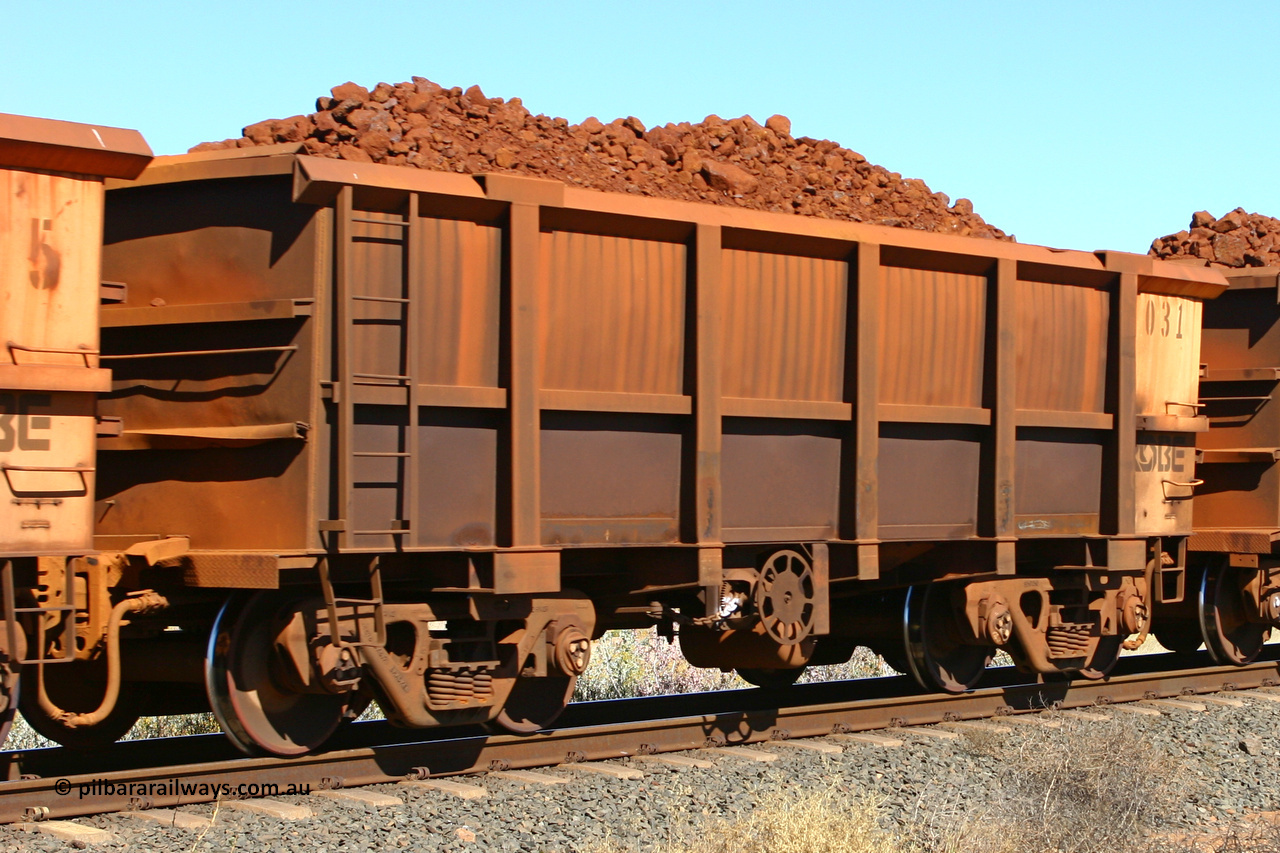 0031 060716 7190
Robe River ore waggon 031, built by Nippon Sharyo Nihon, fixed coupler end handbrake side loaded view at the 71 km on the Deepdale line, Western Creek, July 16, 2006.
Keywords: 031;Nippon-Sharyo-Nihon;Robe-ore-waggon;