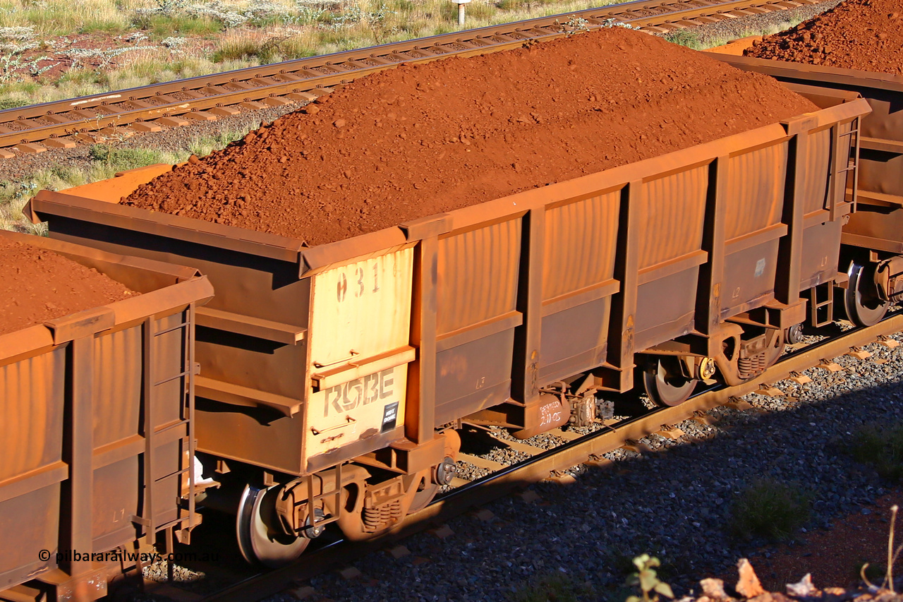 0031 210322 9694
Robe River ore waggon 031, built by Nippon Sharyo Nihon, rotary coupler end non-handbrake side loaded view at the 17 km on the Cape Lambert line, March 22, 2021.
Keywords: 031;Nippon-Sharyo-Nihon;Robe-ore-waggon;