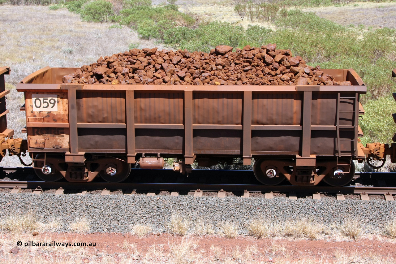 0059 081209 0115
Robe River ore waggon 059, built by Nippon Sharyo Nihon, non-handbrake side loaded view at the 7 km location just south of Cape Lambert yard. December 9, 2008.
Keywords: 059;Nippon-Sharyo-Nihon;Robe-ore-waggon;