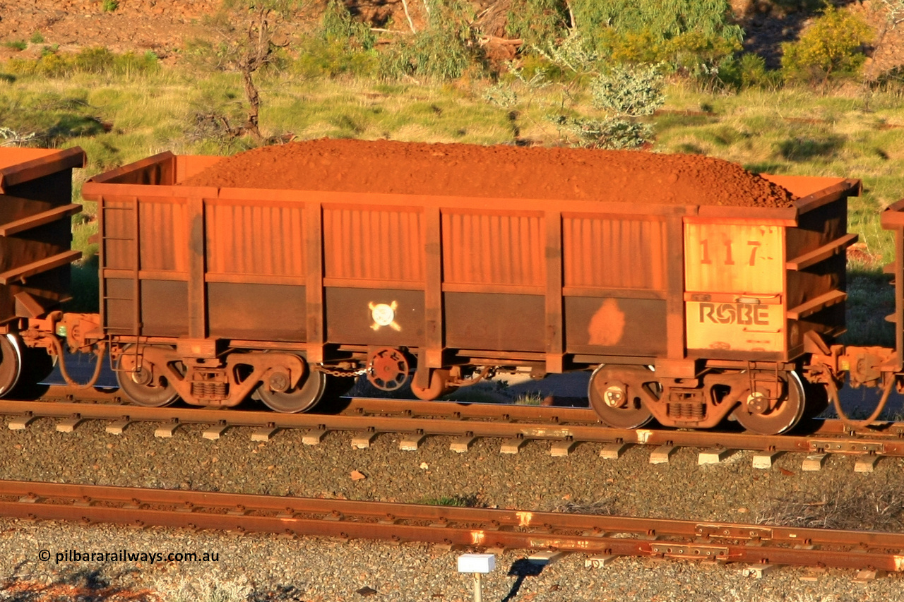 0117 110602 1637
Robe River ore waggon 117, built by Nippon Sharyo Nihon, rotary coupler end handbrake side loaded view at the 71 km, Western Creek on the Deepdale line. June 2, 2011.
Keywords: 117;Nippon-Sharyo-Nihon;Robe-ore-waggon;