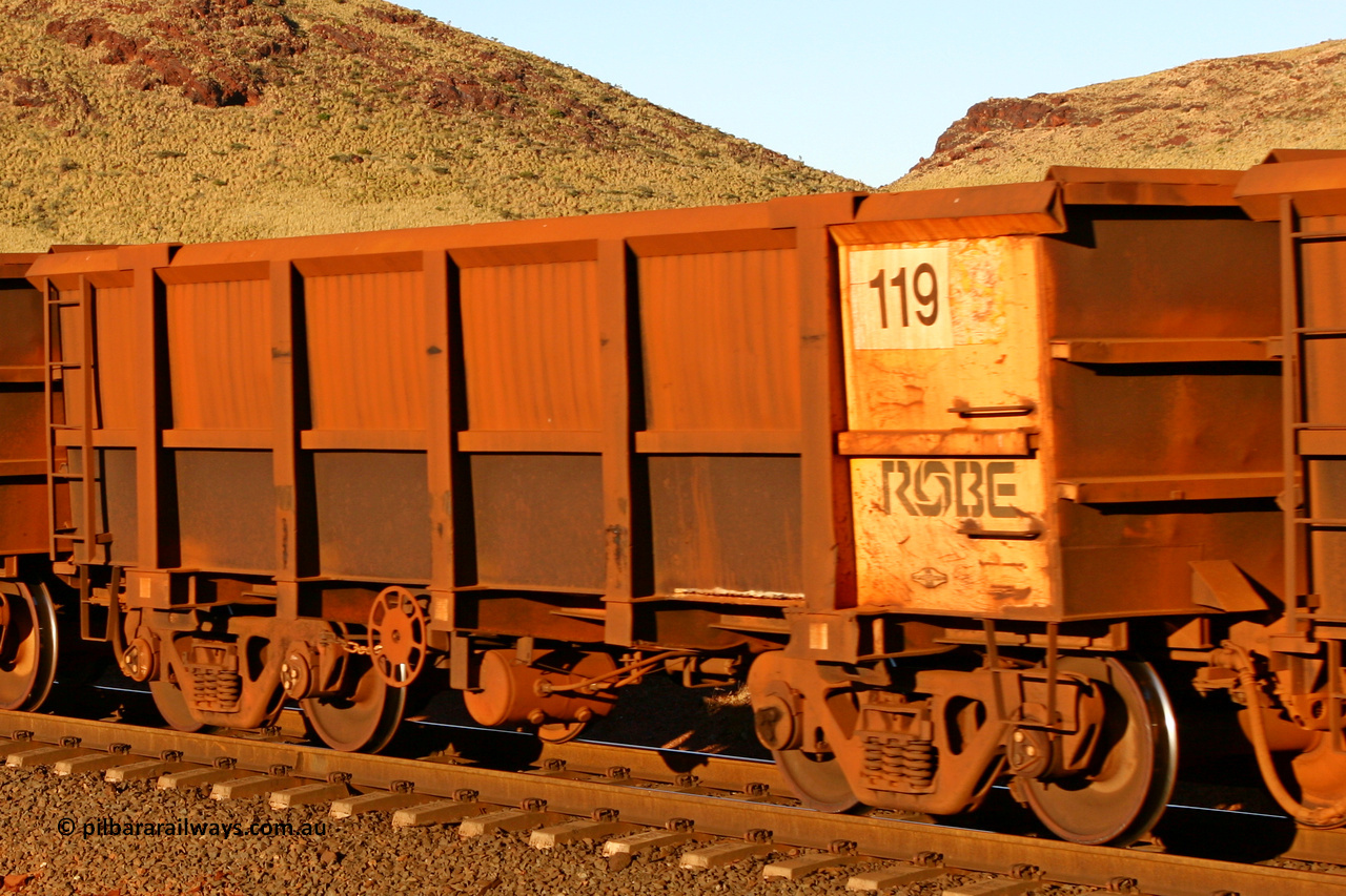 0119 060722 7591
Robe River ore waggon 119, built by Nippon Sharyo Nihon, rotary coupler end handbrake side empty view at the 11.7 km, Cape Lambert. July 22, 2006.
Keywords: 119;Nippon-Sharyo-Nihon;Robe-ore-waggon;