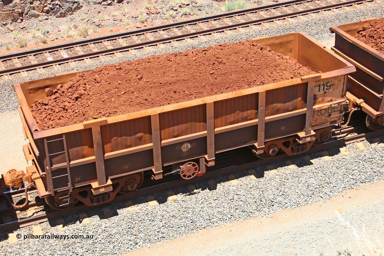0119 160306 1457
Robe River ore waggon 119, built by Nippon Sharyo Nihon, fixed coupler handbrake side loaded view at the 45 km, Harding Siding on the Cape Lambert line. March 6, 2016.
Keywords: 119;Nippon-Sharyo-Nihon;Robe-ore-waggon;