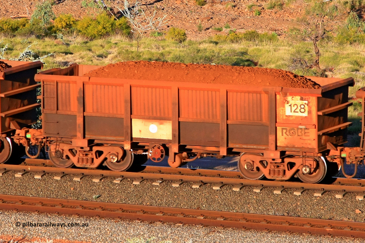 0128 110602 1720
Robe River ore waggon 128, built by Nippon Sharyo Nihon, rotary coupler end handbrake side loaded view at the 71 km, Western Creek on the Deepdale line. June 2, 2011.
Keywords: 128;Nippon-Sharyo-Nihon;Robe-ore-waggon;