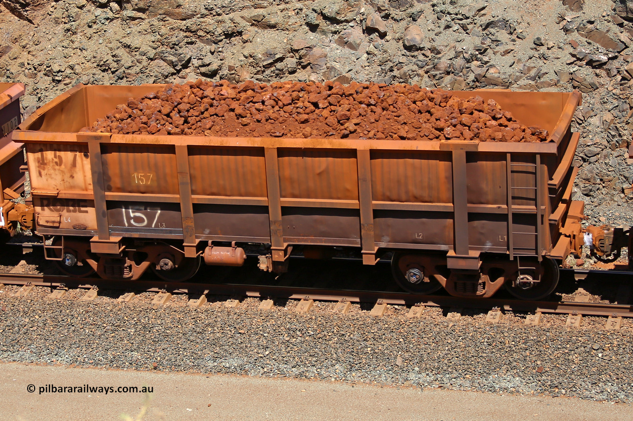 0157 160306 1672
Robe River ore waggon 157, built by Nippon Sharyo Nihon, fixed coupler non-handbrake side loaded view at the 45 km, Harding Siding on the Cape Lambert line. March 6, 2016.
Keywords: 157;Nippon-Sharyo-Nihon;Robe-ore-waggon;
