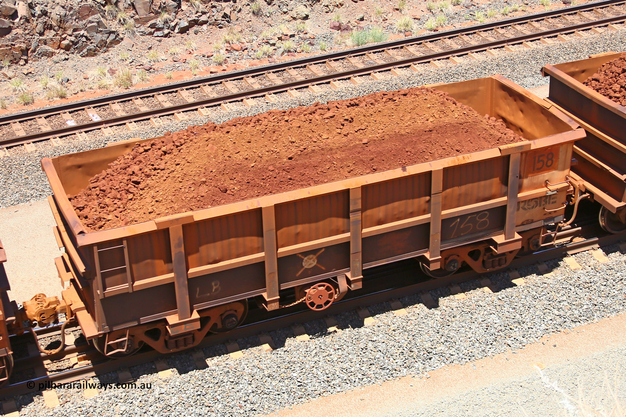 0158 160306 1470
Robe River ore waggon 158, built by Nippon Sharyo Nihon, fixed coupler handbrake side loaded view at the 45 km, Harding Siding on the Cape Lambert line. March 6, 2016.
Keywords: 158;Nippon-Sharyo-Nihon;Robe-ore-waggon;