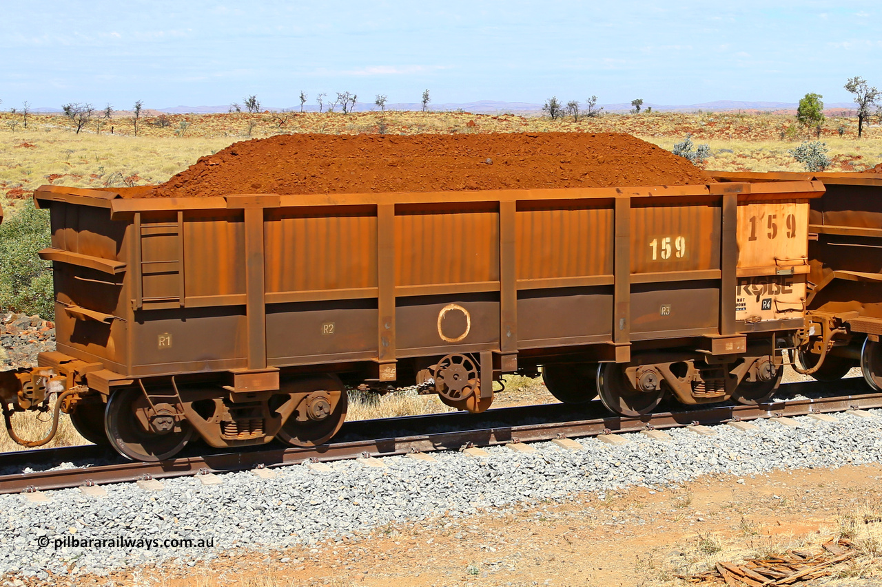 0159 170729 0228
Robe River ore waggon 159, built by Nippon Sharyo Nihon, fixed coupler handbrake side loaded view at the 103 km, between Maitland Siding and the Fortescue River on the Deepdale line. July 29, 2017.
Keywords: 159;Nippon-Sharyo-Nihon;Robe-ore-waggon;