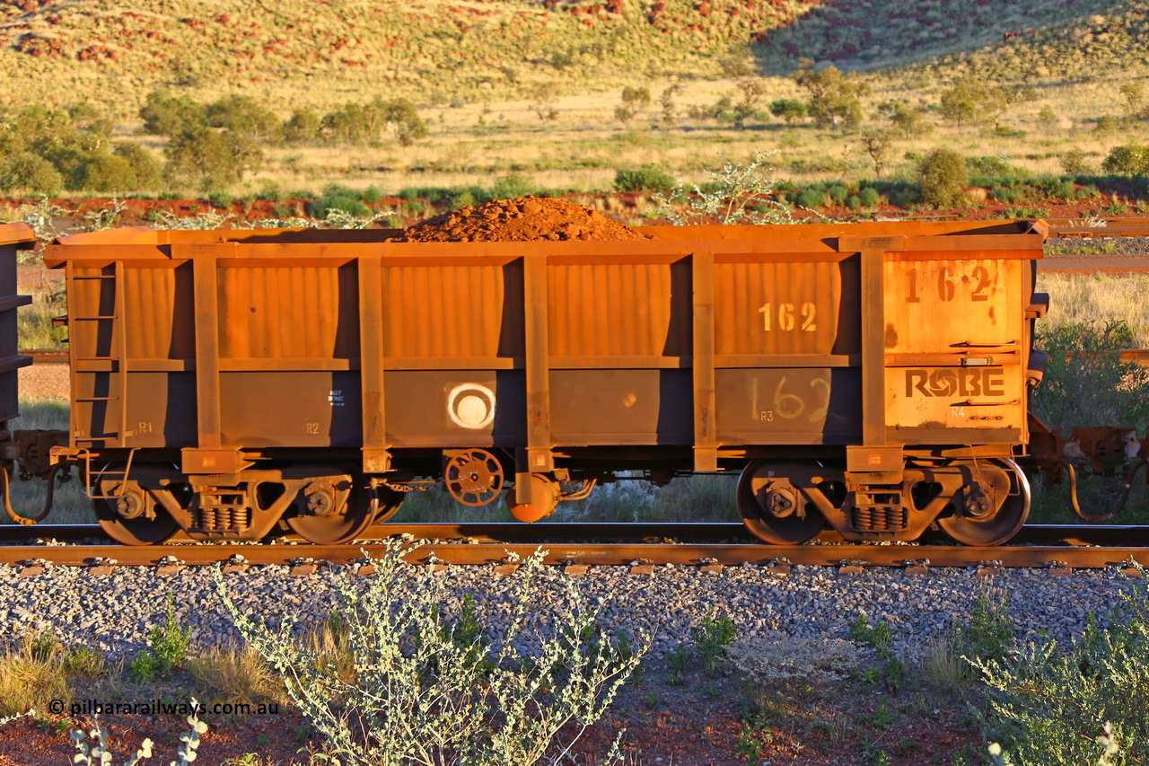 0162 170513 8762
Robe River ore waggon 162, built by Nippon Sharyo Nihon, handbrake side, only partially loaded, view, Cape Lambert yard, May 13, 2017.
Keywords: 162;Nippon-Sharyo-Nihon;Robe-ore-waggon;