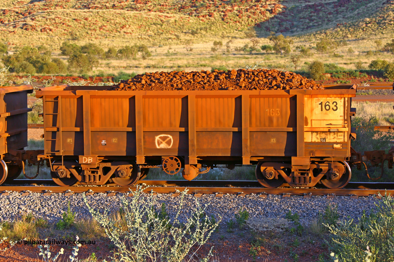 0163 170513 8732
Robe River ore waggon 163, built by Nippon Sharyo Nihon, handbrake side loaded view, panel repair with Centurion Industries waybill holder,  Cape Lambert yard, May 13, 2017.
Keywords: 163;Nippon-Sharyo-Nihon;Robe-ore-waggon;