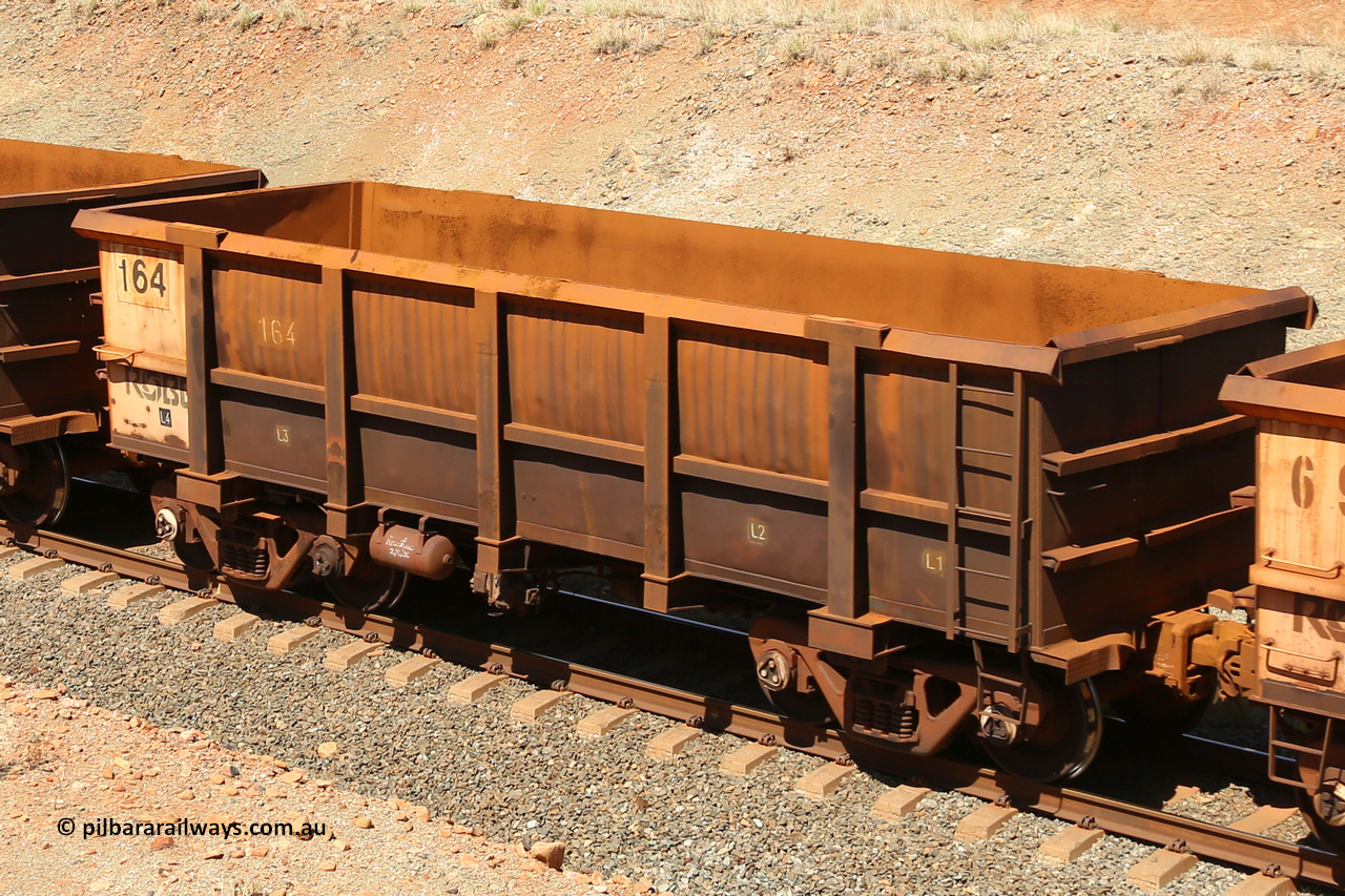 0164 160306 1279
Robe River ore waggon 164, built by Nippon Sharyo Nihon, fixed coupler non-handbrake side empty view at Greenpool on the Cape Lambert line. March 6, 2016.
Keywords: 164;Nippon-Sharyo-Nihon;Robe-ore-waggon;