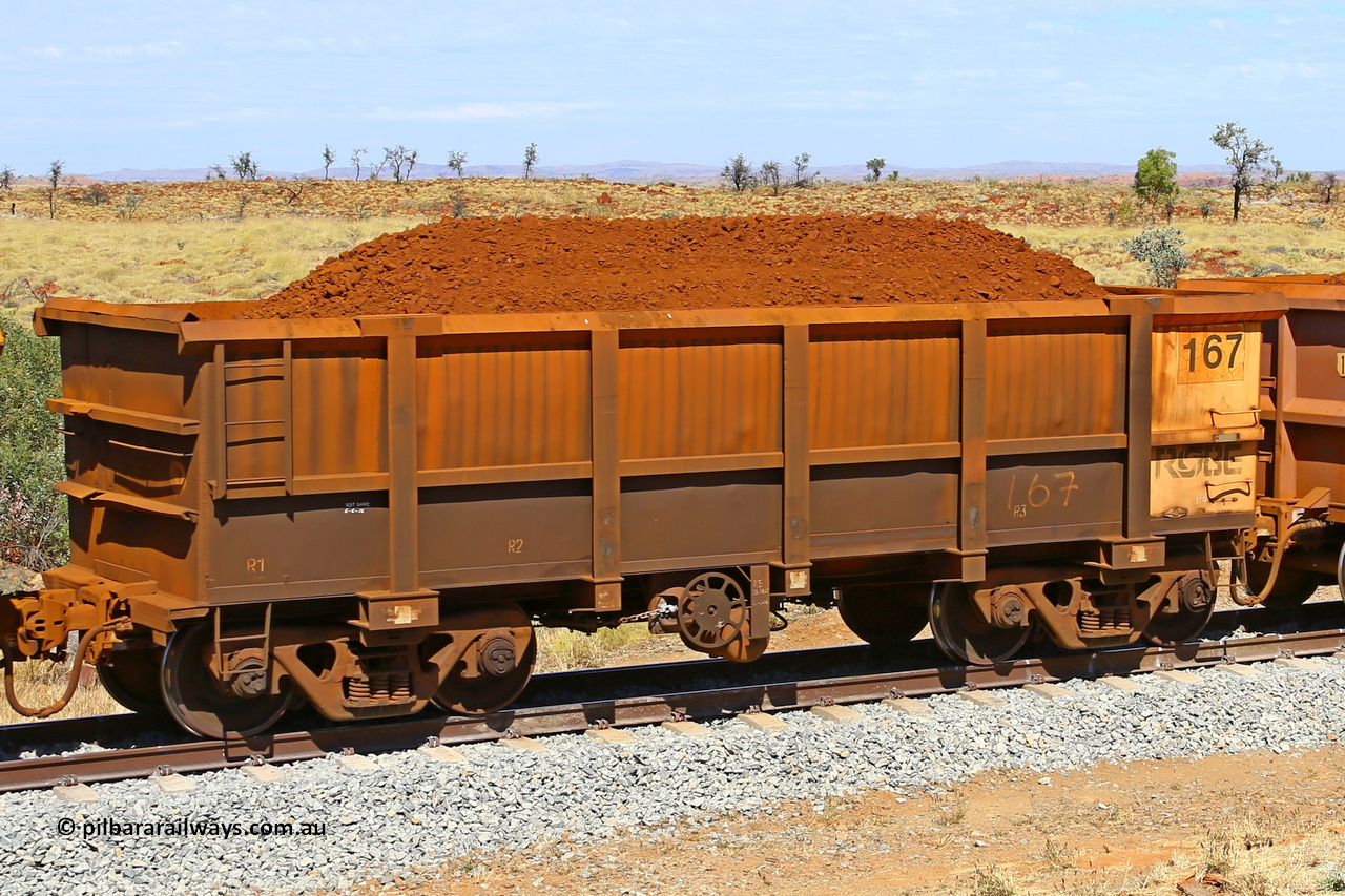 0167 170729 0214
Robe River ore waggon 167, built by Nippon Sharyo Nihon, fixed coupler handbrake side loaded view at the 103 km, between Maitland Siding and the Fortescue River on the Deepdale line. July 29, 2017.
Keywords: 167;Nippon-Sharyo-Nihon;Robe-ore-waggon;