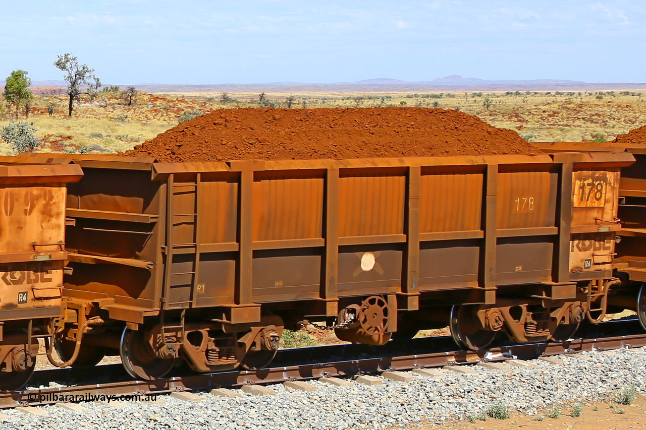 0178 170729 0218
Robe River ore waggon 178, built by Nippon Sharyo Nihon, fixed coupler handbrake side loaded view at the 103 km, between Maitland Siding and the Fortescue River on the Deepdale line. July 29, 2017.
Keywords: 178;Nippon-Sharyo-Nihon;Robe-ore-waggon;