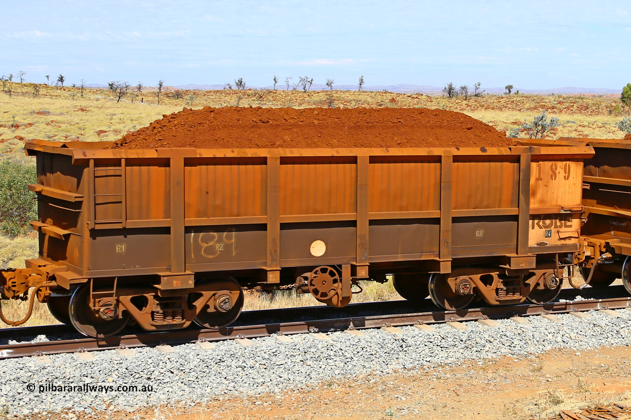 0189 170729 0237
Robe River ore waggon 189, built by Nippon Sharyo Nihon, fixed coupler handbrake side loaded view at the 103 km, between Maitland Siding and the Fortescue River on the Deepdale line. July 29, 2017.
Keywords: 189;Nippon-Sharyo-Nihon;Robe-ore-waggon;