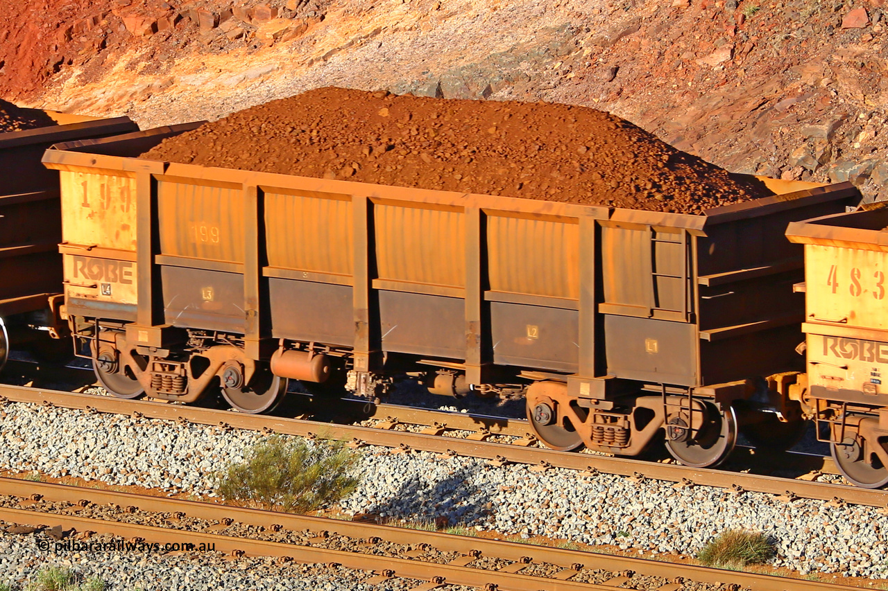 0199 180616 1646
Robe River ore waggon 199, built by Nippon Sharyo Nihon, fixed coupler non-handbrake side loaded view at the 38.5 km, Harding on the Cape Lambert line, June 16, 2018.
Keywords: 199;Nippon-Sharyo-Nihon;Robe-ore-waggon;