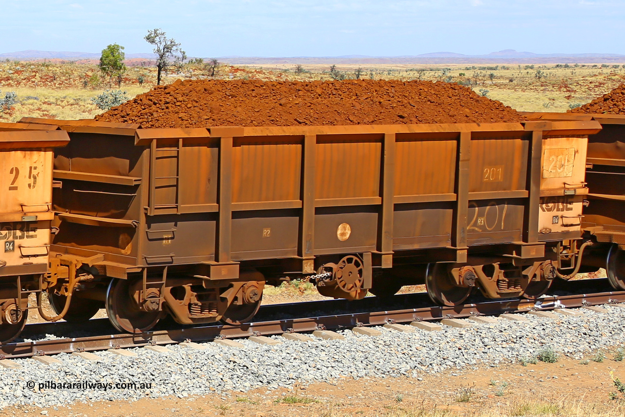 0201 170729 0206
Robe River ore waggon 201, built by Nippon Sharyo Nihon, fixed coupler handbrake side loaded view at the 103 km, between Maitland Siding and the Fortescue River on the Deepdale line. July 29, 2017.
Keywords: 201;Nippon-Sharyo-Nihon;Robe-ore-waggon;