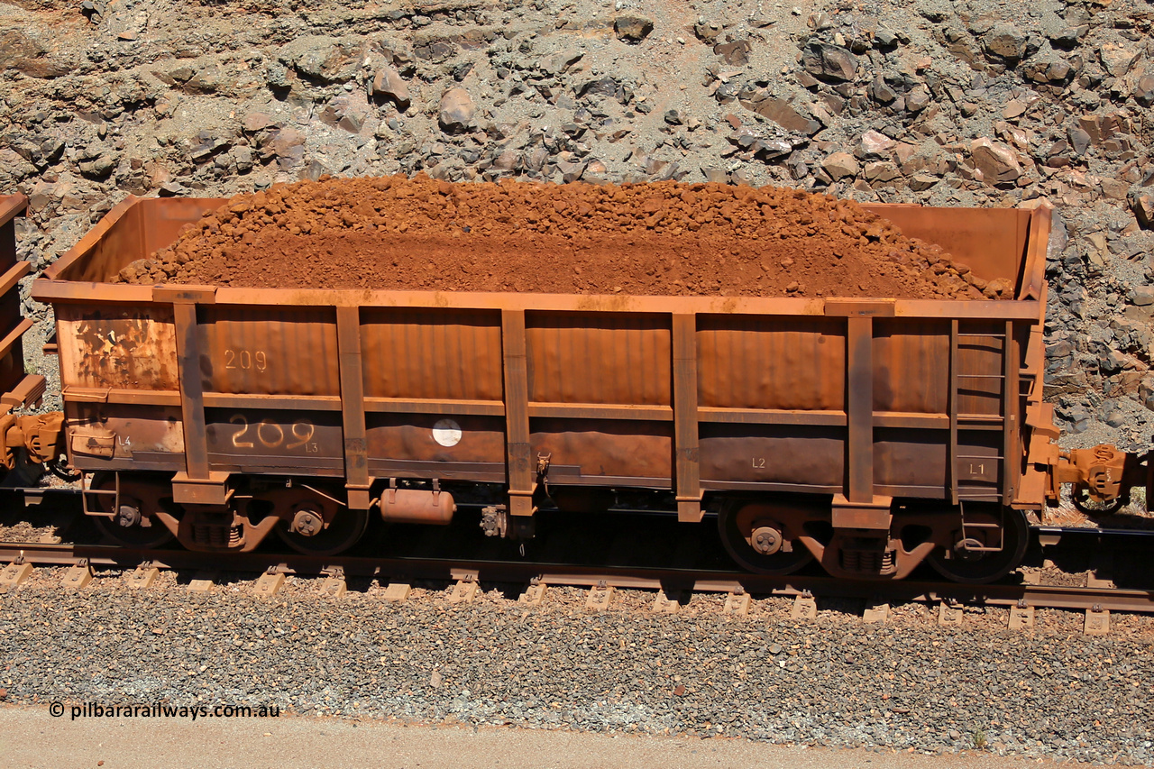 0209 160306 1603
Robe River ore waggon 209, built by Nippon Sharyo Nihon, fixed coupler non-handbrake side loaded view at the 45 km, Harding Siding on the Cape Lambert line. March 6, 2016.
Keywords: 209;Nippon-Sharyo-Nihon;Robe-ore-waggon;