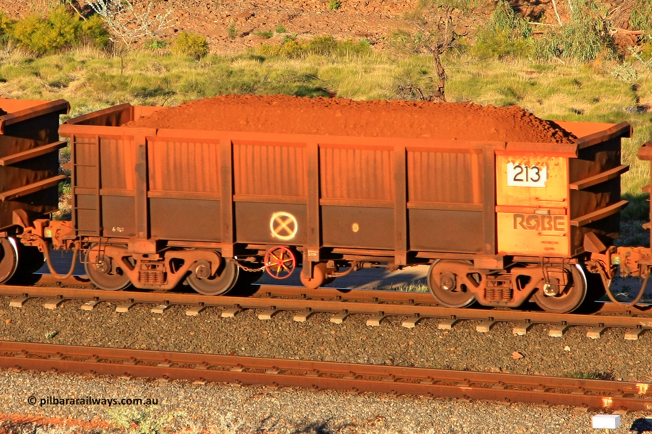 0213 110602 1681
Robe River ore waggon 213, built by Nippon Sharyo Nihon, rotary coupler end handbrake side loaded view at the 71 km, Western Creek on the Deepdale line. June 2, 2011.
Keywords: 213;Nippon-Sharyo-Nihon;Robe-ore-waggon;
