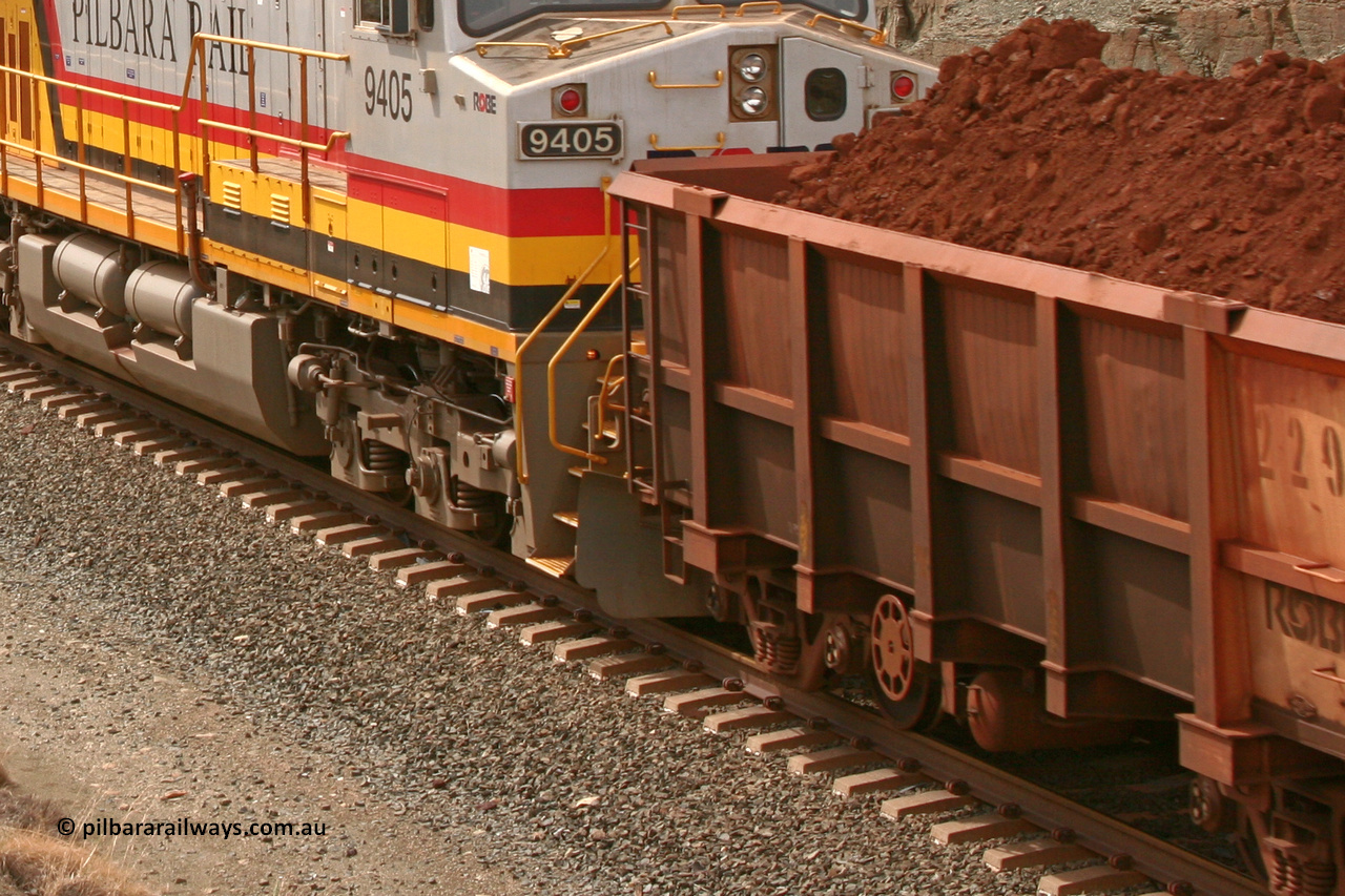 0229 050501 1778
Robe River ore waggon 229, built by Nippon Sharyo Nihon, rotary coupler end handbrake side view loaded near the 107 km between Maitland Siding and the Fortescue River on the Deepdale line. 1129 hours, May 1, 2005.
Keywords: 229;Nippon-Sharyo-Nihon;Robe-ore-waggon;