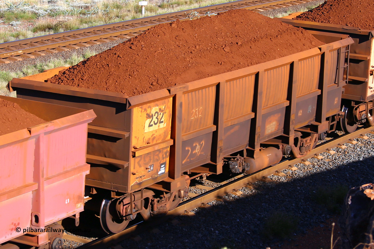 0232 210322 9701
Robe River ore waggon 232, built by Nippon Sharyo Nihon, rotary coupler end non-handbrake side loaded view at the 17 km on the Cape Lambert line, March 22, 2021.
Keywords: 232;Nippon-Sharyo-Nihon;Robe-ore-waggon;