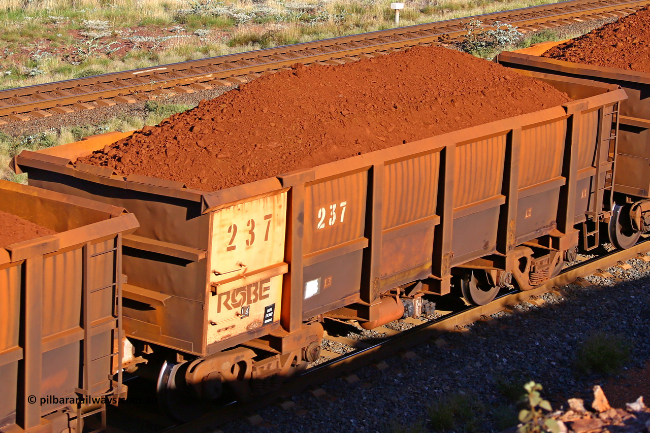 0237 210322 9759
Robe River ore waggon 237, built by Nippon Sharyo Nihon, rotary coupler end non-handbrake side loaded view at the 17 km on the Cape Lambert line, March 22, 2021.
Keywords: 237;Nippon-Sharyo-Nihon;Robe-ore-waggon;