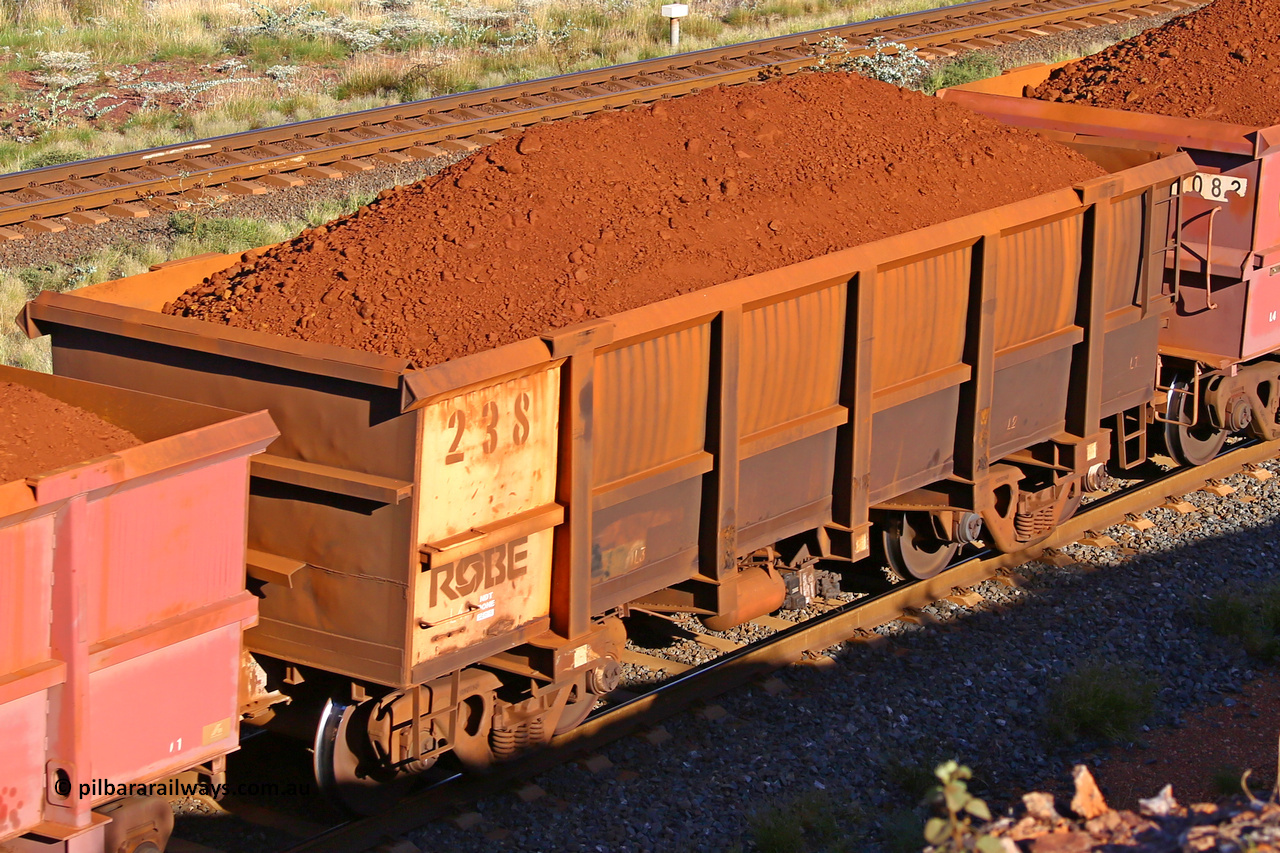 0238 210322 9726
Robe River ore waggon 238, built by Nippon Sharyo Nihon, rotary coupler end non-handbrake side loaded view at the 17 km on the Cape Lambert line, March 22, 2021.
Keywords: 238;Nippon-Sharyo-Nihon;Robe-ore-waggon;