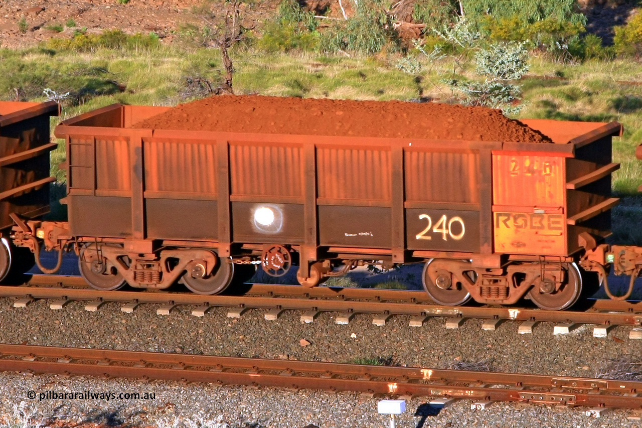 0240 110602 1640
Robe River ore waggon 240, built by Nippon Sharyo Nihon, rotary coupler end handbrake side loaded view at the 71 km, Western Creek on the Deepdale line. June 2, 2011.
Keywords: 240;Nippon-Sharyo-Nihon;Robe-ore-waggon;