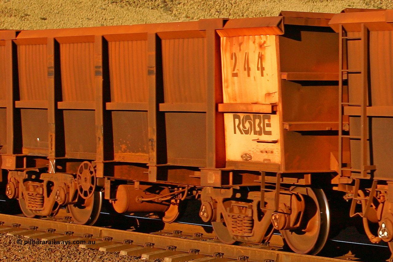 0244 060722 7620
Robe River ore waggon 244, built by Nippon Sharyo Nihon, rotary coupler end handbrake side empty view, at the 11.7 km, Cape Lambert. July 22, 2006.
Keywords: 244;Nippon-Sharyo-Nihon;Robe-ore-waggon;