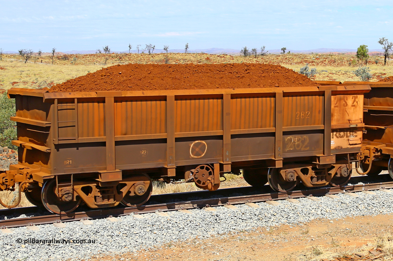 0282 170729 0216
Robe River ore waggon 282, built by Nippon Sharyo Nihon, fixed coupler handbrake side loaded view at the 103 km, between Maitland Siding and the Fortescue River on the Deepdale line. July 29, 2017.
Keywords: 282;Nippon-Sharyo-Nihon;Robe-ore-waggon;