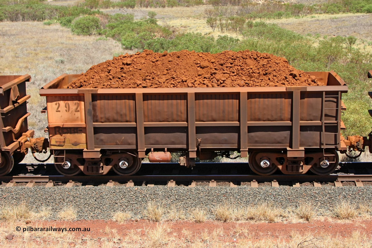 0292 081209 0146
Robe River ore waggon 292, built by Nippon Sharyo Nihon, non-handbrake side loaded view at the 7 km location just south of Cape Lambert yard. December 9, 2008.
Keywords: 292;Nippon-Sharyo-Nihon;Robe-ore-waggon;