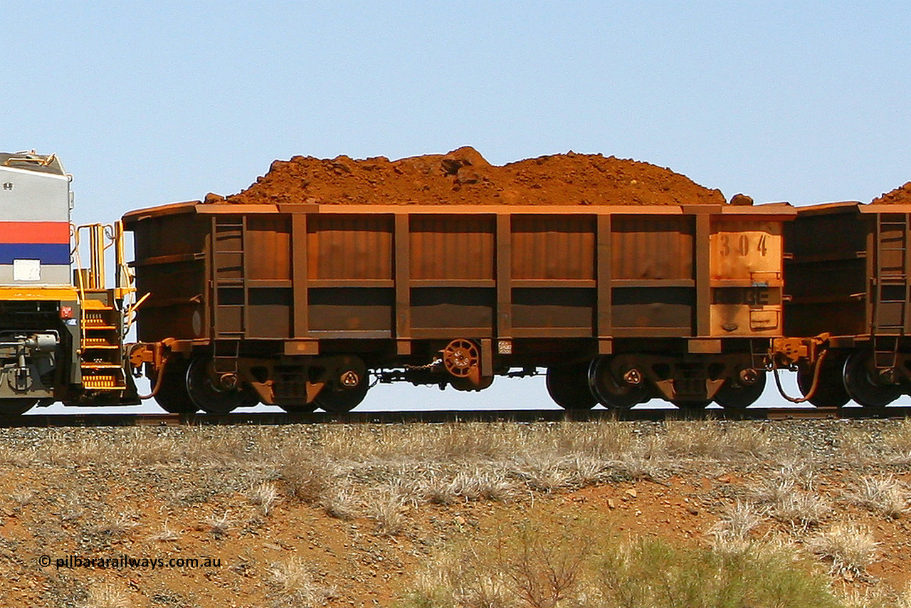 0304 070916 0993
Robe River ore waggon 304, built by Nippon Sharyo Nihon, fixed coupler handbrake side loaded view, at the 73 km, Western Creek on the Deepdale line. September 16, 2007.
Keywords: 304;Nippon-Sharyo-Nihon;Robe-ore-waggon;