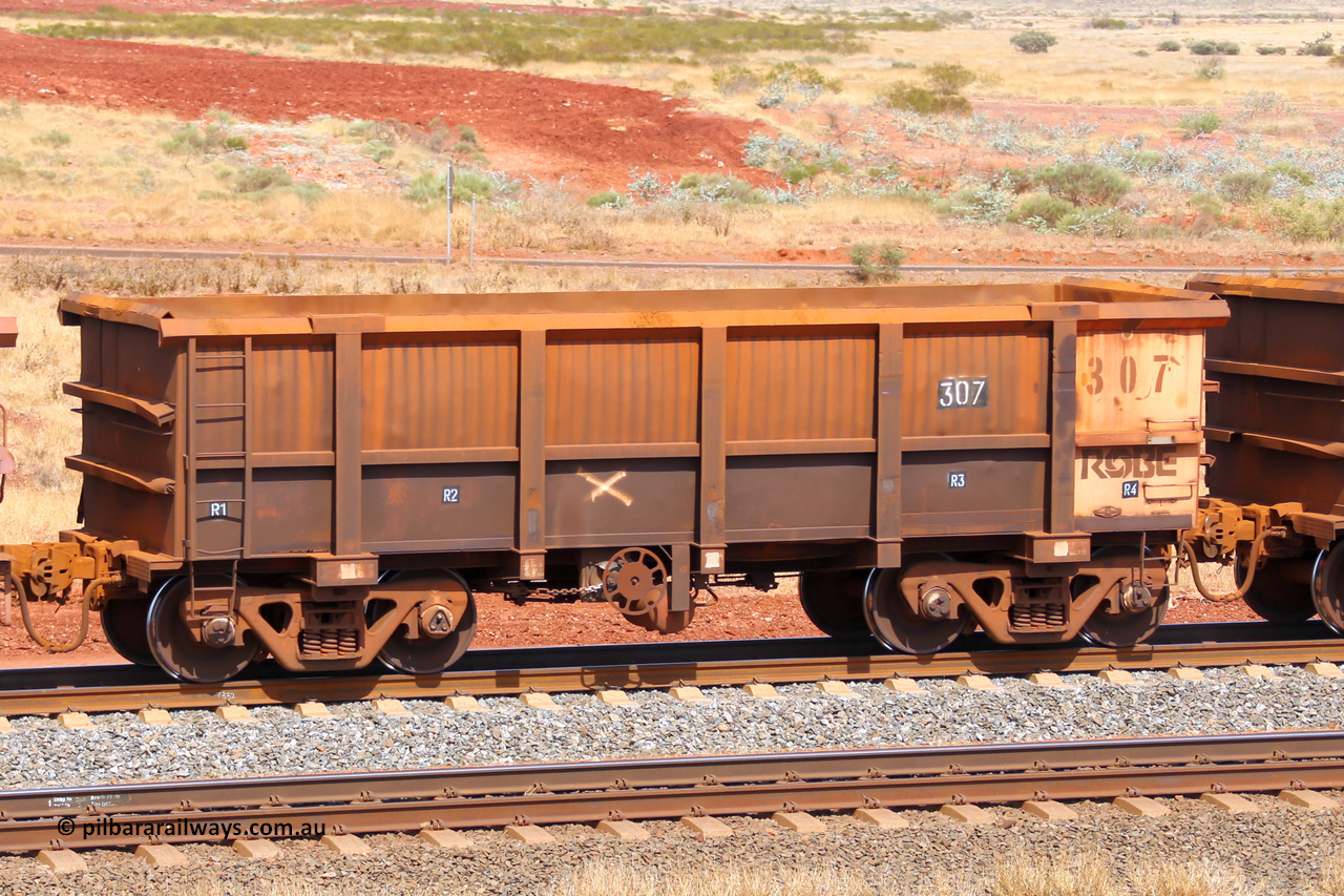 0307 141124 6849
Robe River ore waggon 307, built by Nippon Sharyo Nihon, fixed coupler handbrake side empty view at the 25 km at Arches Siding on the Cape Lambert line. November 24, 2014.
Keywords: 307;Nippon-Sharyo-Nihon;Robe-ore-waggon;