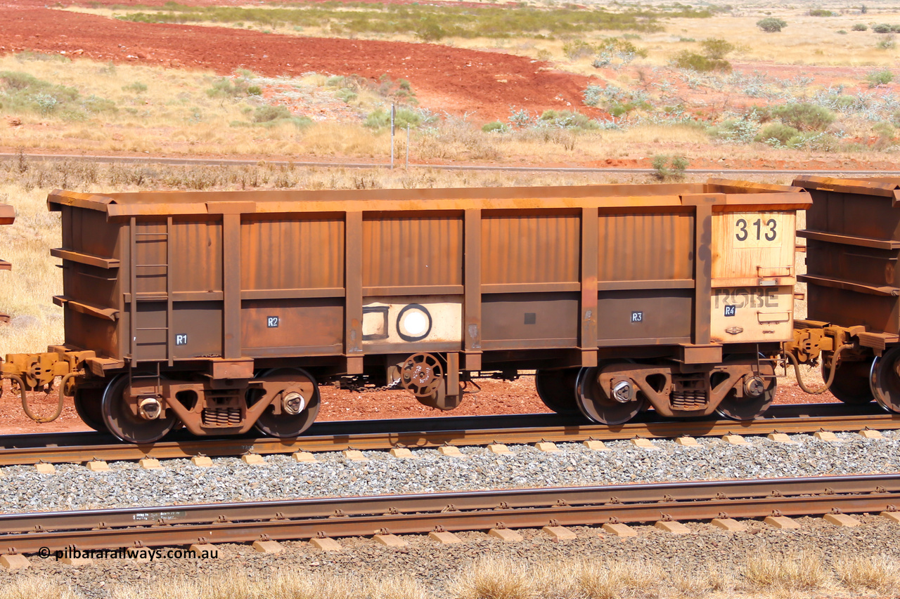 0313 141124 6851
Robe River ore waggon 313, built by Nippon Sharyo Nihon, fixed coupler handbrake side empty view at the 25 km at Arches Siding on the Cape Lambert line. November 24, 2014.
Keywords: 313;Nippon-Sharyo-Nihon;Robe-ore-waggon;