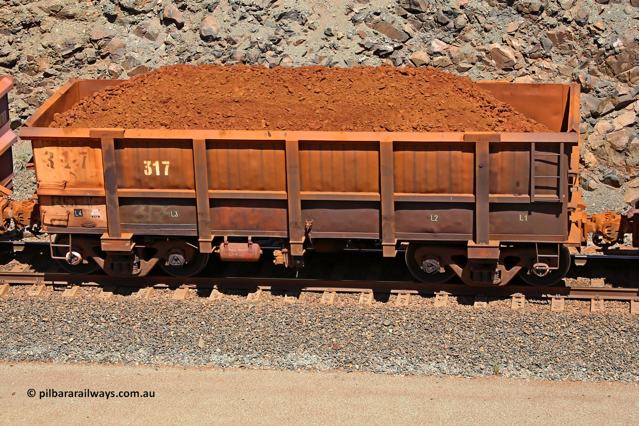 0317 160306 1533
Robe River ore waggon 317, built by Nippon Sharyo Nihon, fixed coupler non-handbrake side loaded view at the 45 km, Harding Siding on the Cape Lambert line. March 6, 2016.
Keywords: 317;Nippon-Sharyo-Nihon;Robe-ore-waggon;