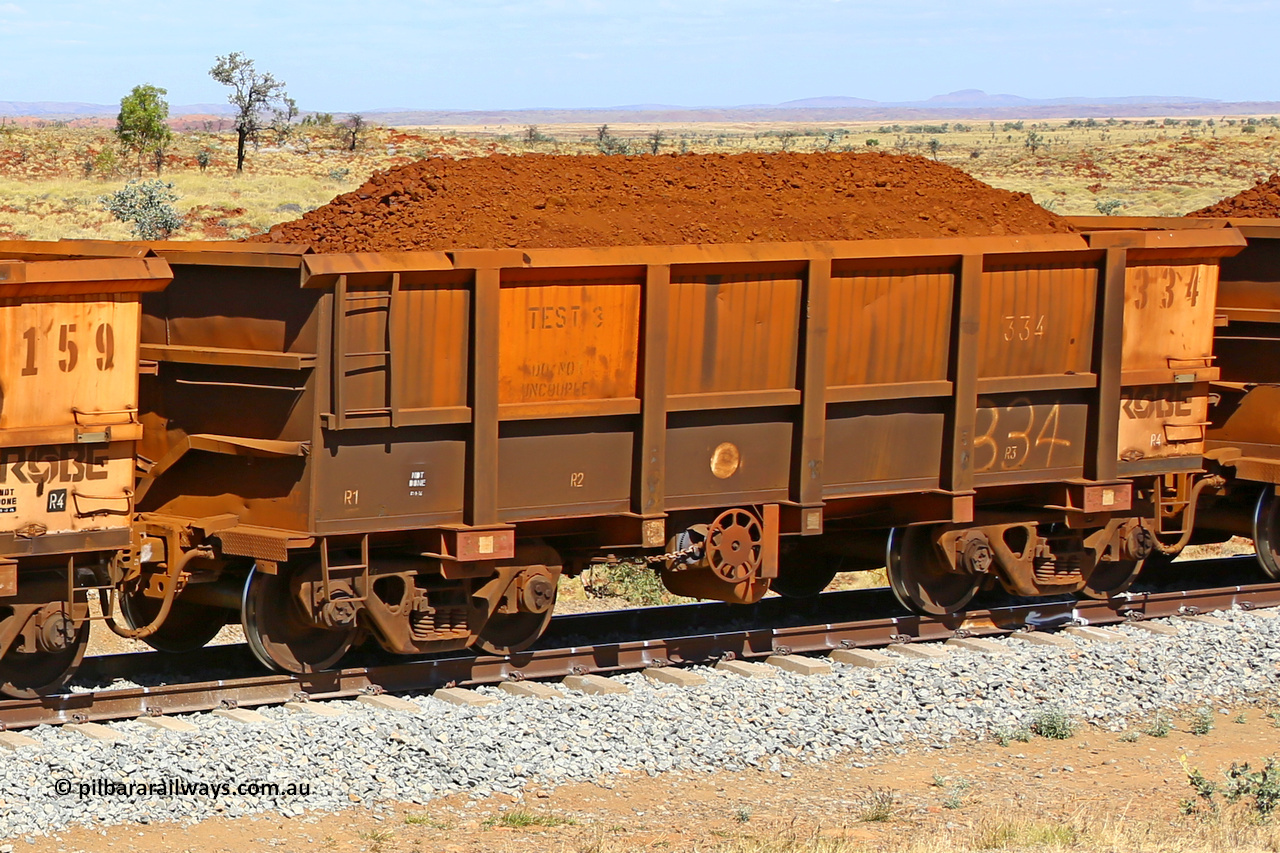 0334 170729 0228
Robe River ore waggon 334, built by Nippon Sharyo Nihon, fixed coupler handbrake side loaded view. Stencil says TEST 3 DO NOT UNCOUPLE, at the 103 km, between Maitland Siding and the Fortescue River on the Deepdale line. July 29, 2017.
Keywords: 334;Nippon-Sharyo-Nihon;Robe-ore-waggon;