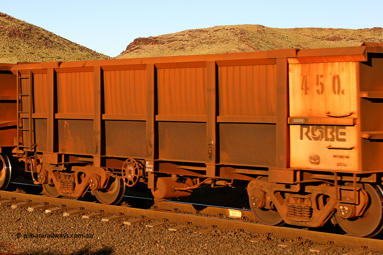 0450 060722 7618
Robe River ore waggon 450, built by Tomlinson Steel WA, rotary coupler end handbrake side empty view, at the 11.7 km, Cape Lambert. July 22, 2006.
Keywords: 450;Tomlinson-Steel-WA;Robe-ore-waggon;