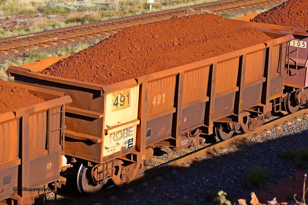 0491 210322 9722
Robe River ore waggon 491, built by Tomlinson Steel WA, rotary coupler end non-handbrake side loaded view at the 17 km on the Cape Lambert line, March 22, 2021.
Keywords: 491;Tomlinson-Steel-WA;Robe-ore-waggon;