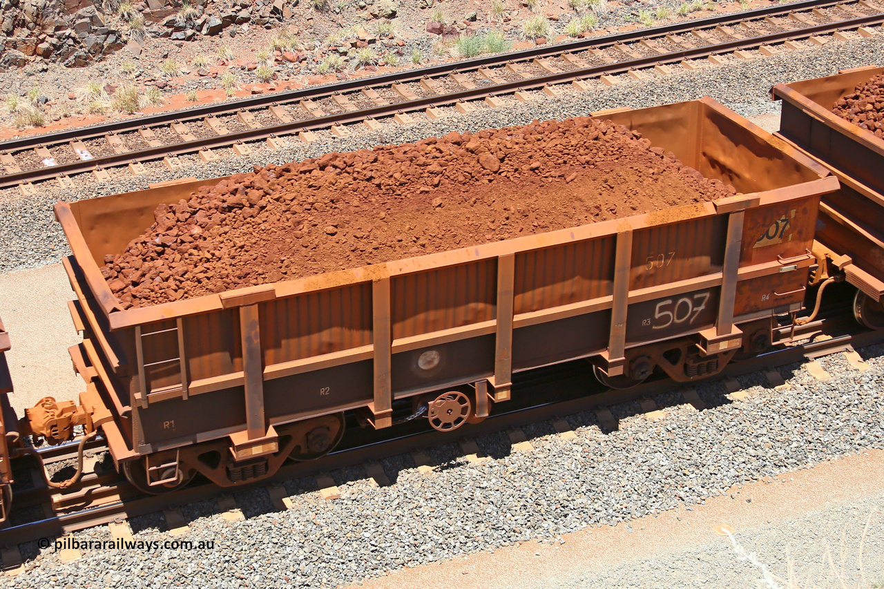 0507 160306 1487
Robe River ore waggon 507, built by Tomlinson Steel WA, fixed coupler handbrake side loaded view, at the 45 km, Harding Siding on the Cape Lambert line. March 6, 2016.
Keywords: 507;Tomlinson-Steel-WA;Robe-ore-waggon;