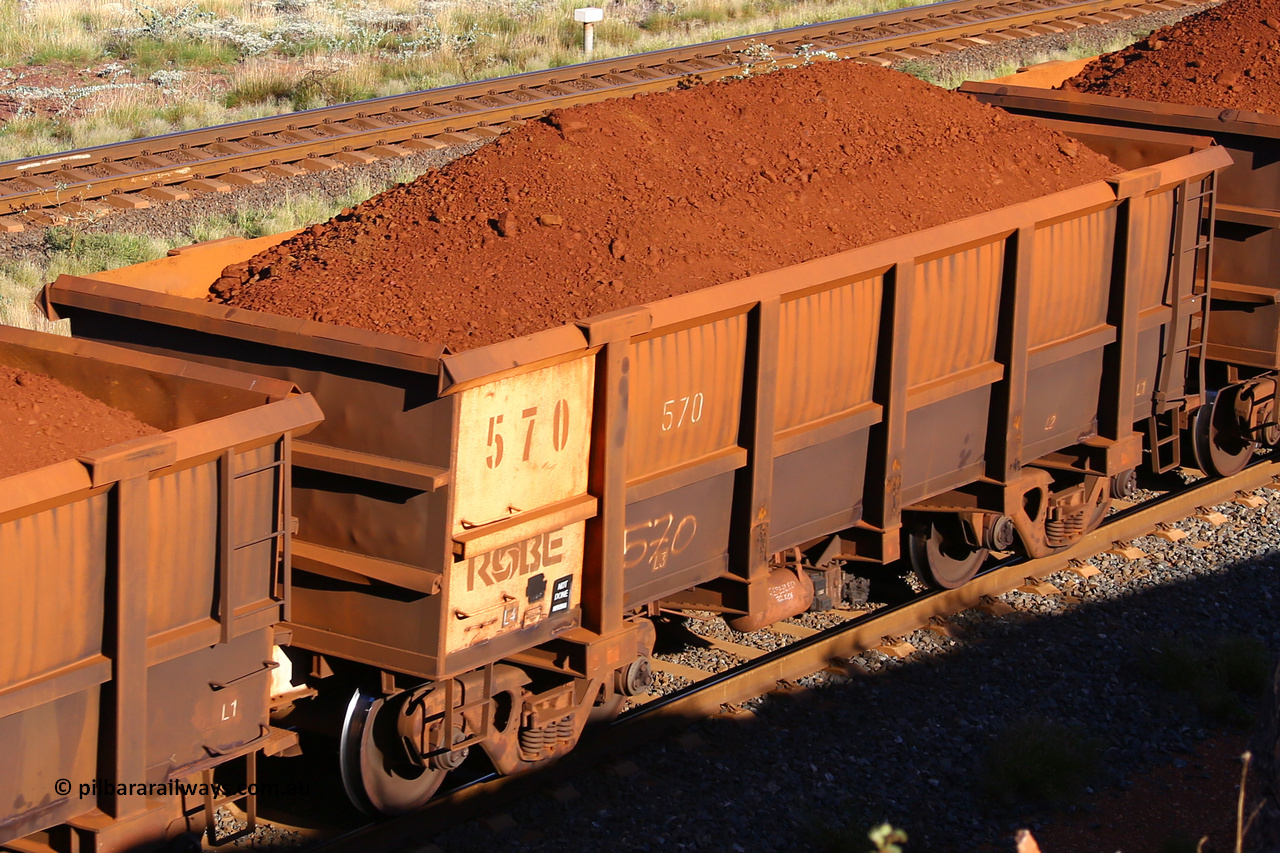 0570 210322 9729
Robe River ore waggon 570, built by Tomlinson Steel WA, rotary coupler end non-handbrake side loaded view at the 17 km on the Cape Lambert line, March 22, 2021.
Keywords: 570;Tomlinson-Steel-WA;Robe-ore-waggon;