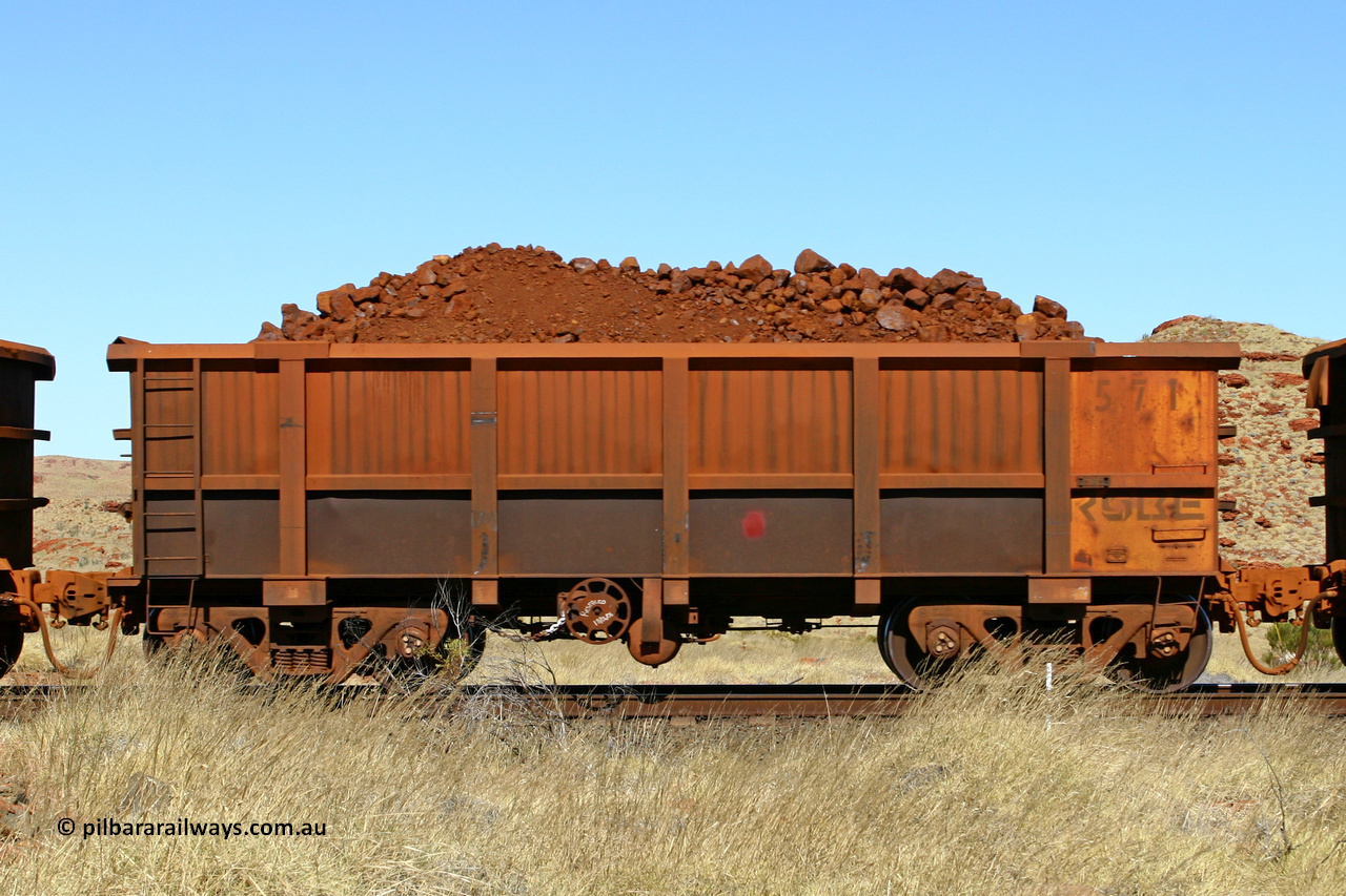 0571 060722 7502
Robe River ore waggon 571, built by Tomlinson Steel WA, handbrake side loaded view at the 78.8 km between Western Creek and Maitland on the Deepdale line. July 22, 2006.
Keywords: 571;Tomlinson-Steel-WA;Robe-ore-waggon;