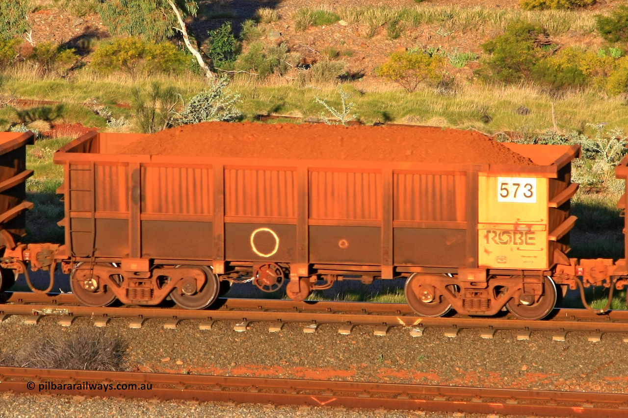 0573 110602 1660
Robe River ore waggon 573, built by Tomlinson Steel WA, rotary coupler end handbrake side loaded view at the 71 km, Western Creek on the Deepdale line. June 2, 2011.
Keywords: 573;Tomlinson-Steel-WA;Robe-ore-waggon;