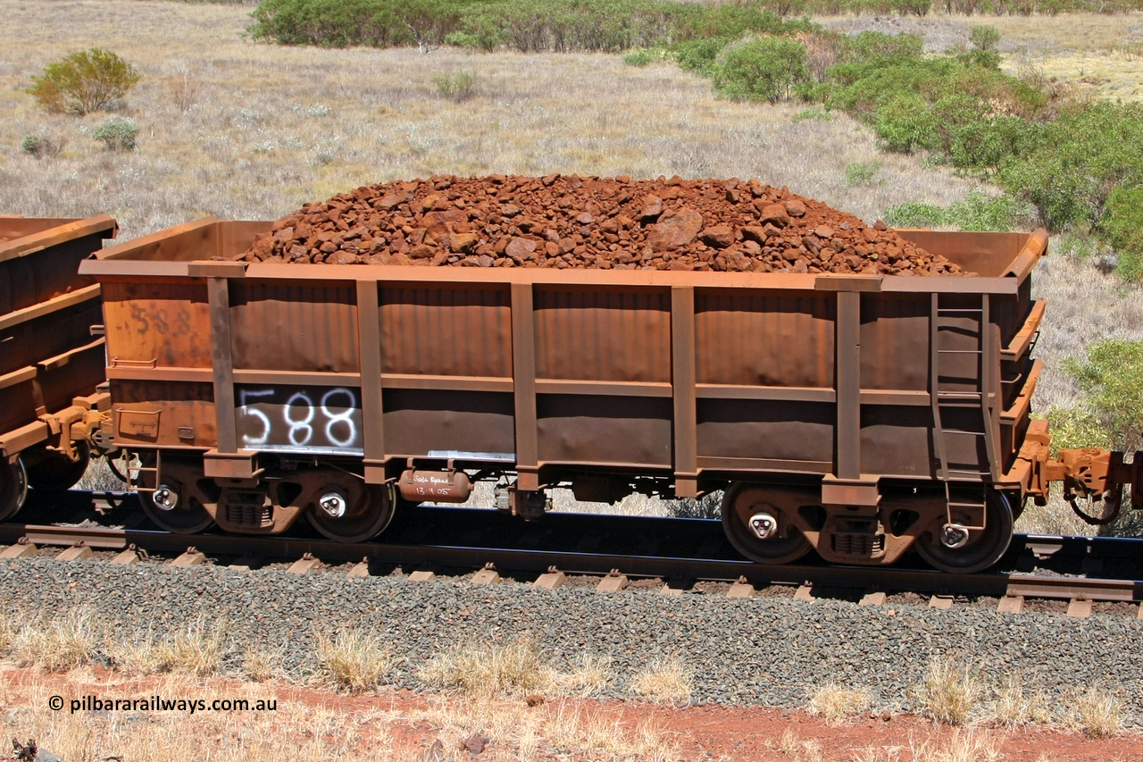 0588 081209 0152
Robe River ore waggon 588, built by Tomlinson Steel WA, fixed coupler non-handbrake side loaded view at the 7 km location just south of Cape Lambert yard. December 9, 2008.
Keywords: 588;Tomlinson-Steel-WA;Robe-ore-waggon;