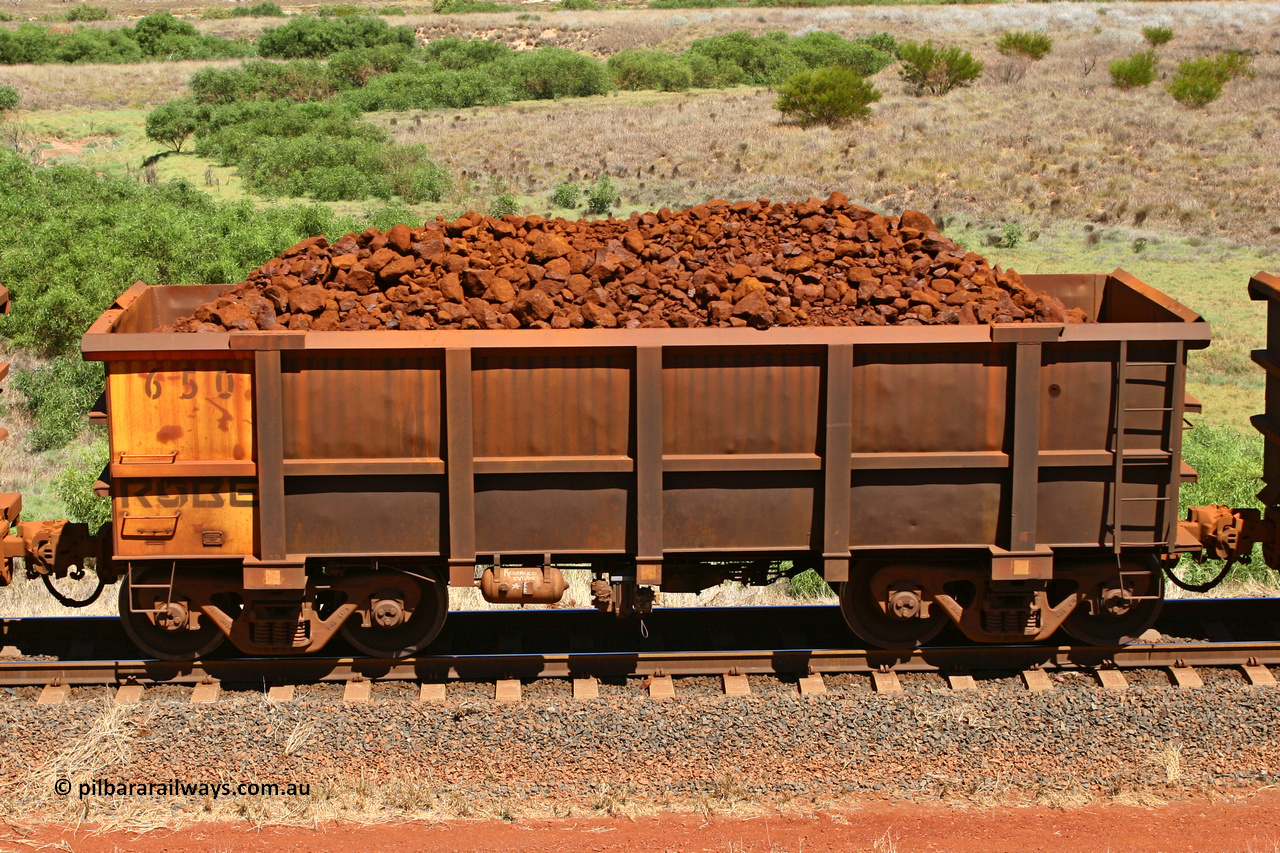 0650 061209 8183
Robe River ore waggon 650, built by Tomlinson Steel WA, non-handbrake side loaded view at the 7 km location just south of Cape Lambert yard. December 9, 2006.
Keywords: 650;Tomlinson-Steel-WA;Robe-ore-waggon;
