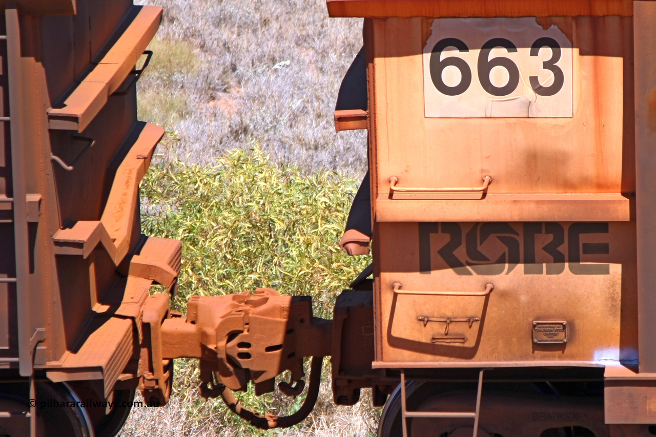 0663 081209 0124
Robe River ore waggon 663, built by Tomlinson Steel WA, rotary coupler end, panel and plate view, also shows drop rib detail on adjoining waggon, at the 7 km location just south of Cape Lambert yard. December 9, 2008.
Keywords: 663;Tomlinson-Steel-WA;Robe-ore-waggon;