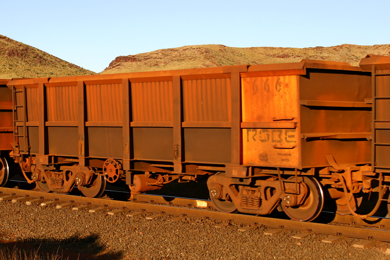 0666 060722 7624
Robe River ore waggon 666, built by Tomlinson Steel WA, rotary coupler end handbrake side empty view, at the 11.7 km, Cape Lambert. July 22, 2006.
Keywords: 666;Tomlinson-Steel-WA;Robe-ore-waggon;