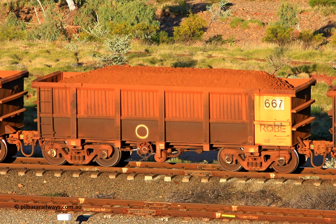 0667 110602 1668
Robe River ore waggon 667, built by Tomlinson Steel WA, rotary coupler end handbrake side loaded view at the 71 km, Western Creek on the Deepdale line. June 2, 2011.
Keywords: 667;Tomlinson-Steel-WA;Robe-ore-waggon;