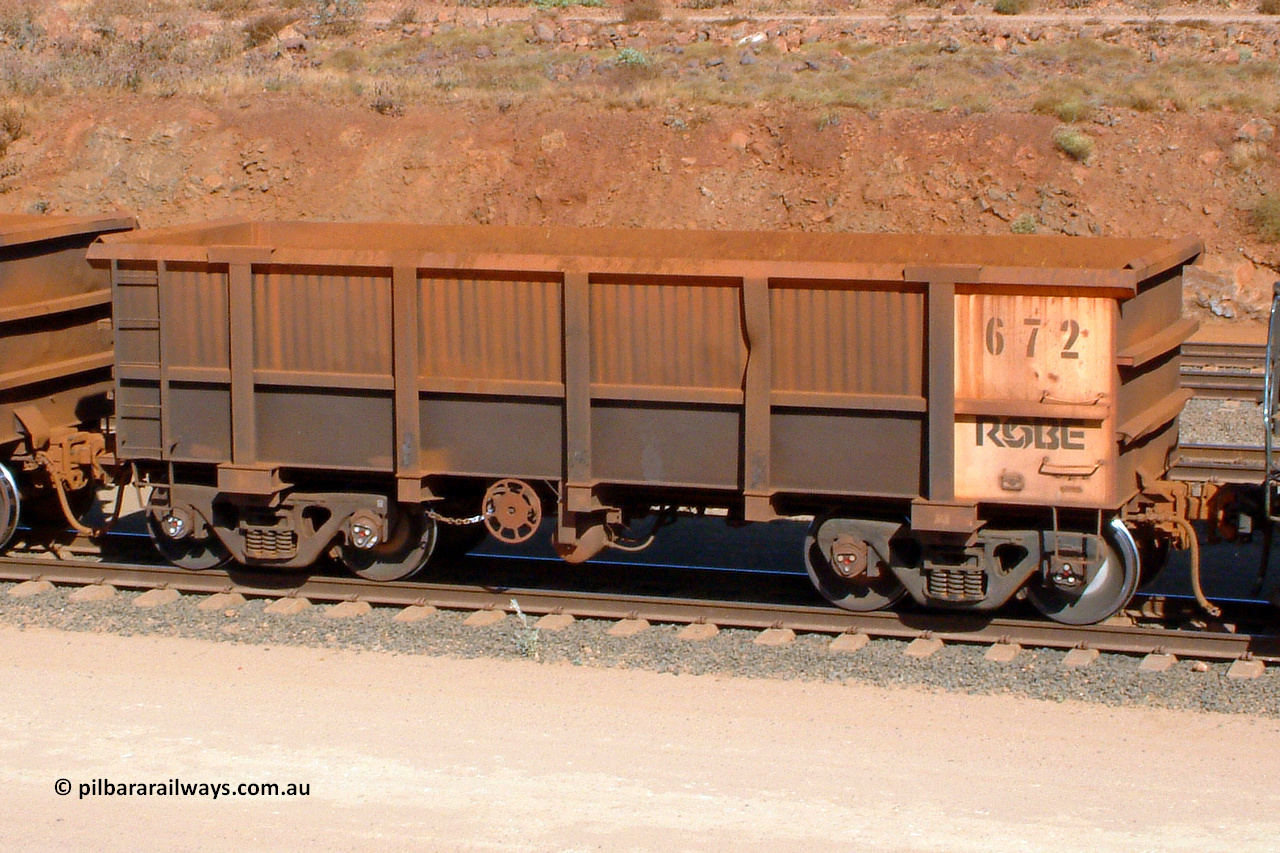 0672 041014 154200
Robe River ore waggon 672, built by Tomlinson Steel WA, rotary coupler end handbrake side empty view, Cape Lambert yard. 1542 hours, October 14, 2004.
Keywords: 672;Tomlinson-Steel-WA;Robe-ore-waggon;