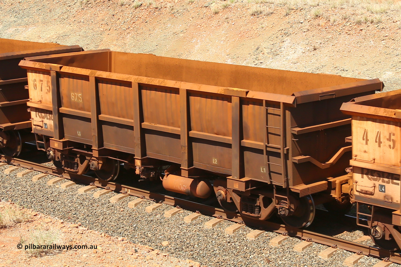 0675 160306 1318
Robe River ore waggon 675, built by Tomlinson Steel WA, fixed coupler non-handbrake side empty view, shows drop rib end, at Greenpool on the Cape Lambert line. March 6, 2016.
Keywords: 675;Tomlinson-Steel-WA;Robe-ore-waggon;