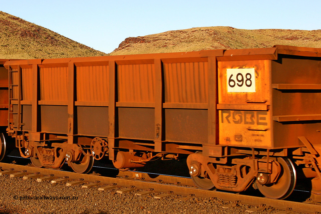 0698 060722 7615
Robe River ore waggon 698, built by Tomlinson Steel WA, rotary coupler end handbrake side empty view, at the 11.7 km, Cape Lambert. July 22, 2006.
Keywords: 698;Tomlinson-Steel-WA;Robe-ore-waggon;