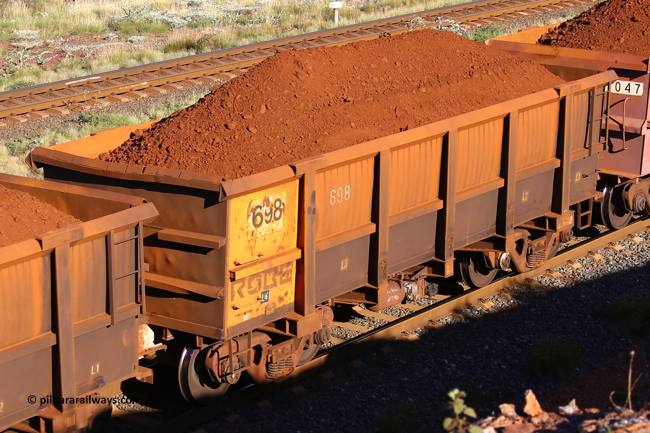 0698 210322 9681
Robe River ore waggon 698, built by Tomlinson Steel WA, rotary coupler end non-handbrake side loaded view at the 17 km on the Cape Lambert line, March 22, 2021.
Keywords: 698;Tomlinson-Steel-WA;Robe-ore-waggon;
