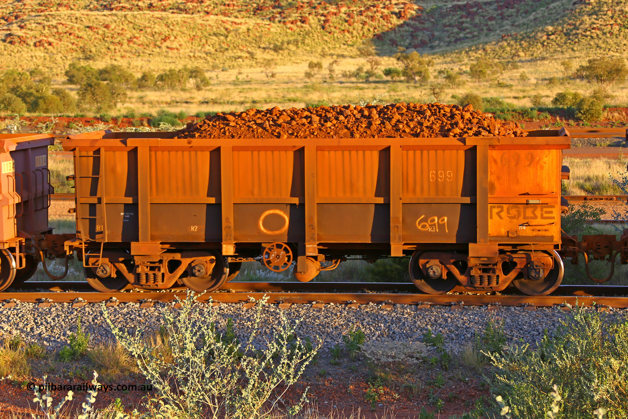 0699 170513 8734
Robe River ore waggon 699, built by Tomlinson Steel WA, rotary coupler end handbrake side loaded view, Cape Lambert yard, May 13, 2017.
Keywords: 699;Tomlinson-Steel-WA;Robe-ore-waggon;