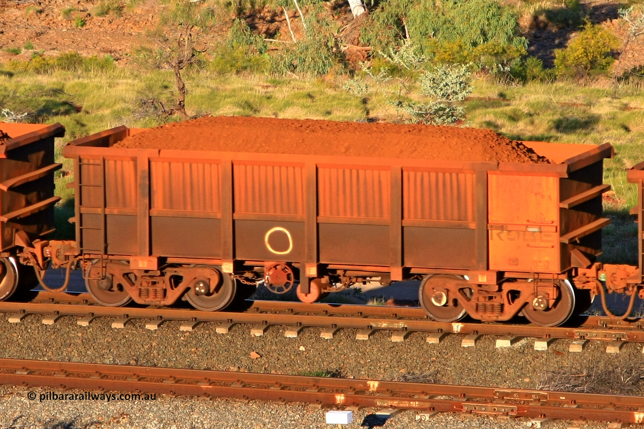0704 110602 1636
Robe River ore waggon 704, built by Tomlinson Steel WA, rotary coupler end handbrake side loaded view at the 71 km, Western Creek on the Deepdale line. June 2, 2011.
Keywords: 704;Tomlinson-Steel-WA;Robe-ore-waggon;